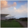 slides/Passing Storm.jpg coast guard cottages east sussex coastal coast blue sky winter sunny seaside snow cold bitter panoramic cliffs white lighthouse seven sisters country park cuckmere haven river beach storm fence road Passing Storm